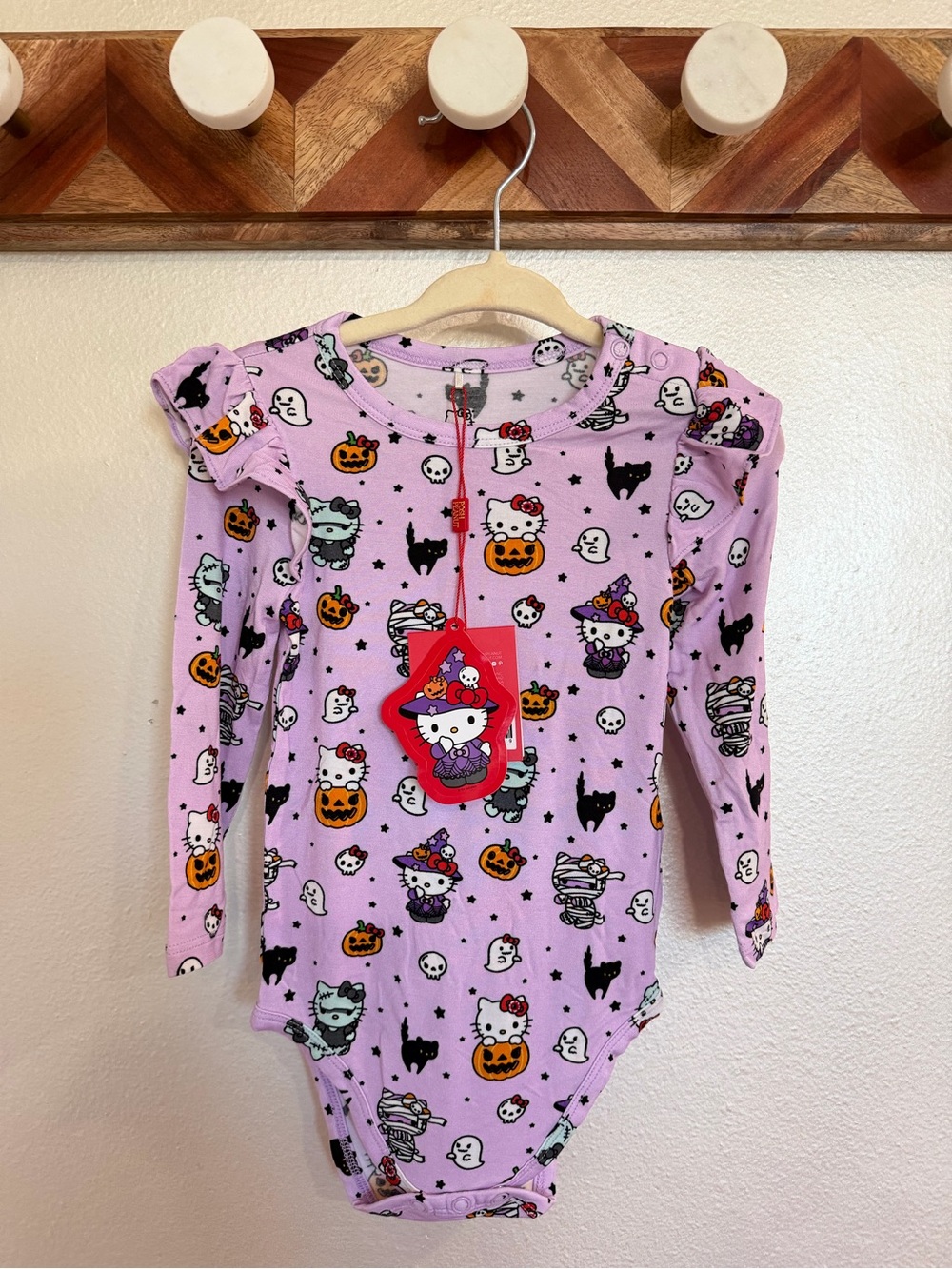 Posh Peanut xHello Kitty Monsters Halloween ruffled long sleeve bodysuit